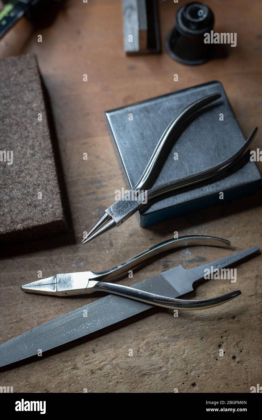 Tools on a goldmsiths workbench. Stock Photo