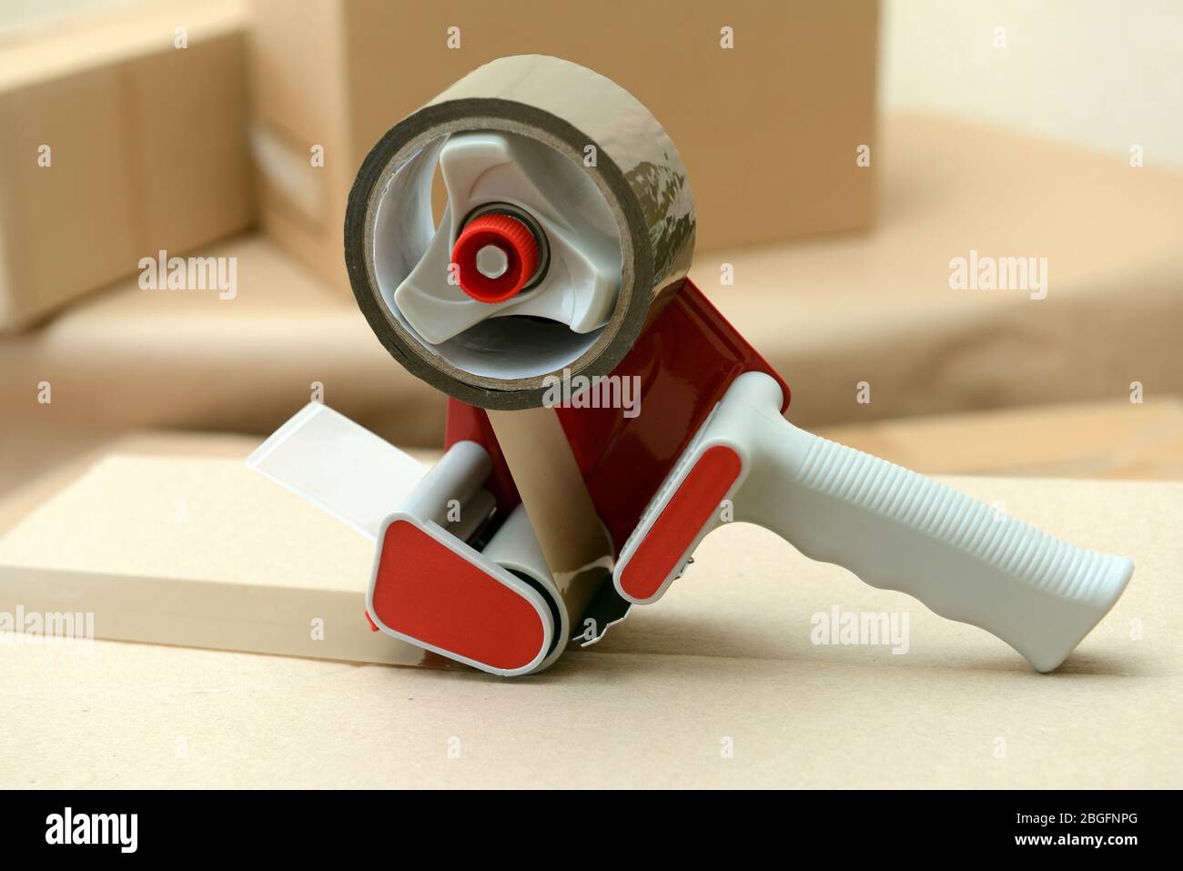 Packaging parcels with dispenser close-up Stock Photo