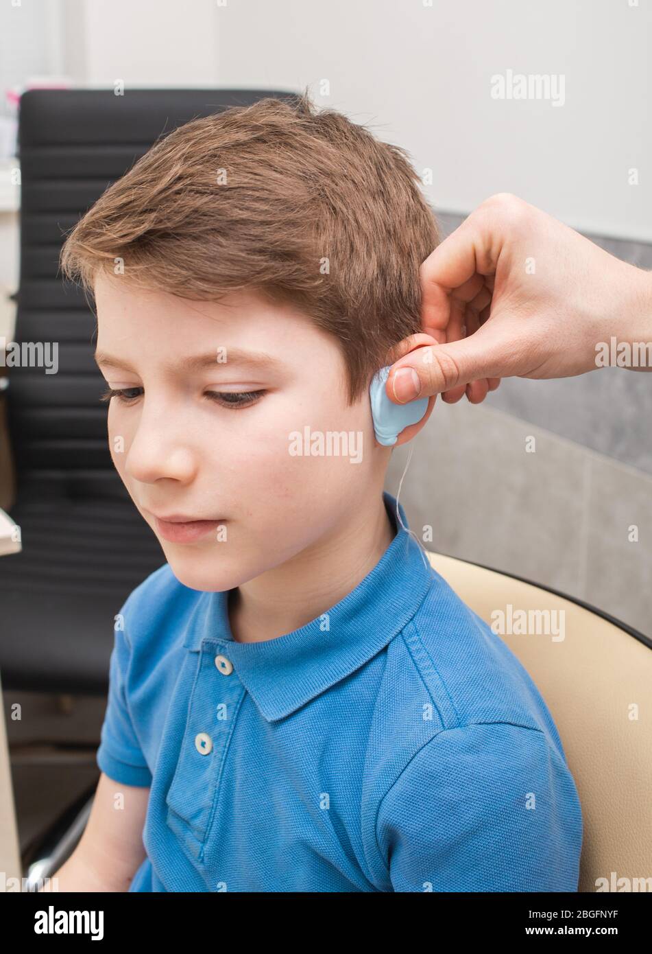 Process of making a custom earplug for a boy. Stages of manufacturing earplugs. Doctor makes
