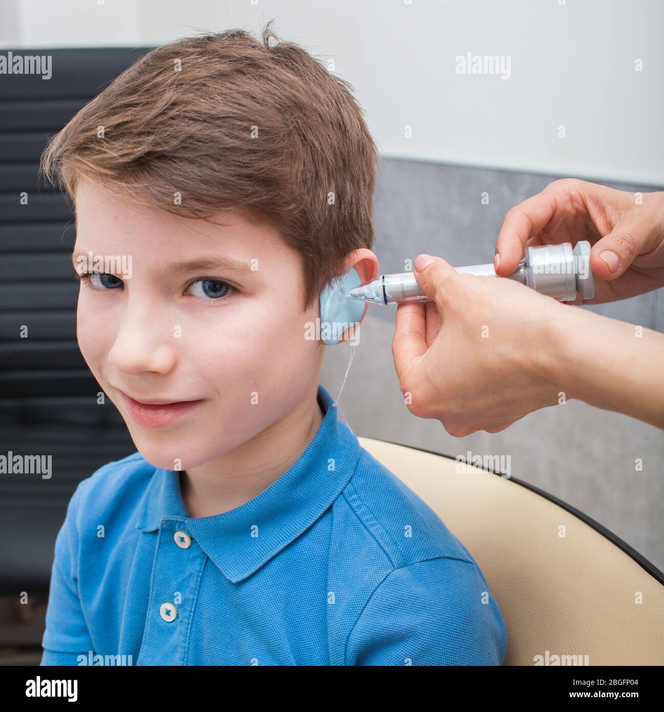 Process of making a custom earplug for a boy. Stages of manufacturing