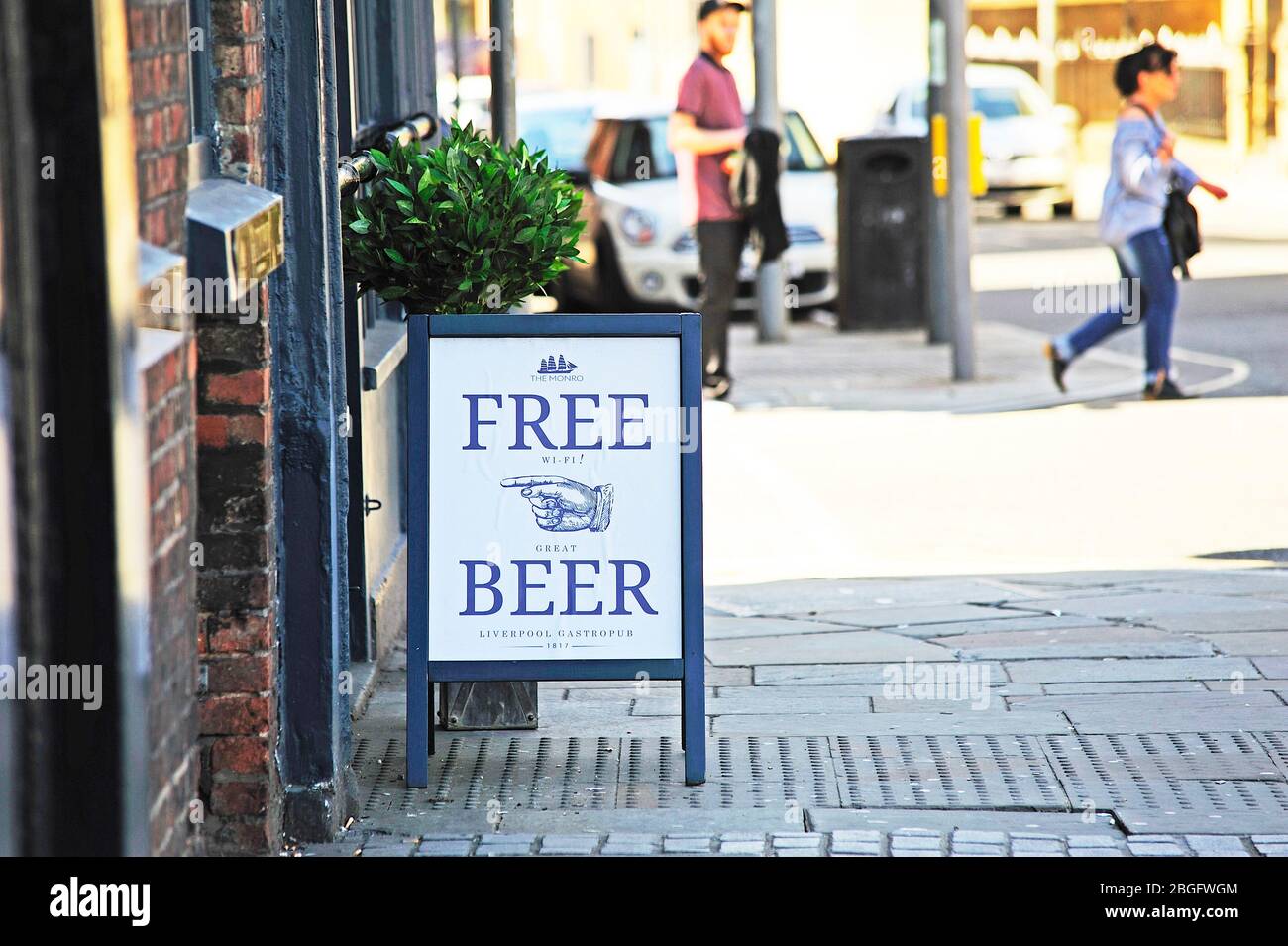 A board sign outside Liverpool city centre pub apparently advertising free beer but not so on closer inspection Stock Photo
