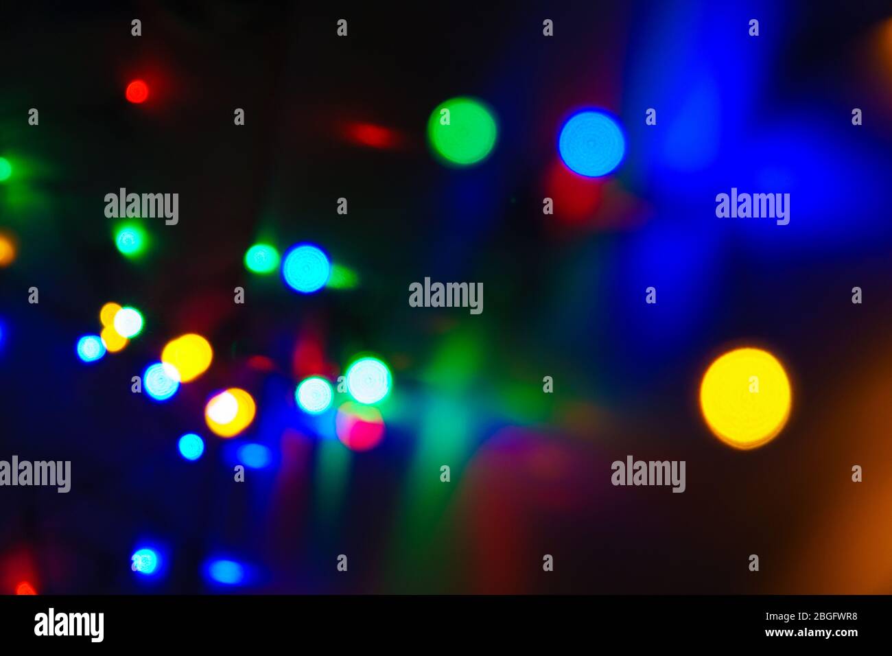 Abstract blurred colorful celebration lights in red, blue, green and ...