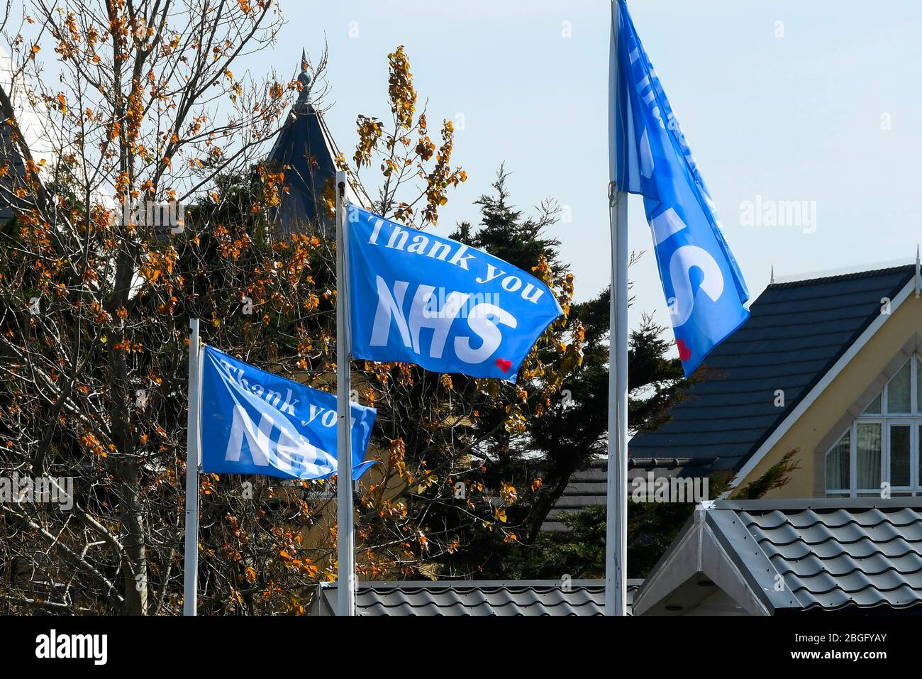 Wyke Regis, Weymouth, Dorset, UK.  21st April 2020.  Flags saying Thank You NHS on flagpoles at Chesil Vista Holiday Park at Wyke Regis in Dorset during the continued coronavirus pandemic lockdown.  Picture Credit: Graham Hunt/Alamy Live News Stock Photo