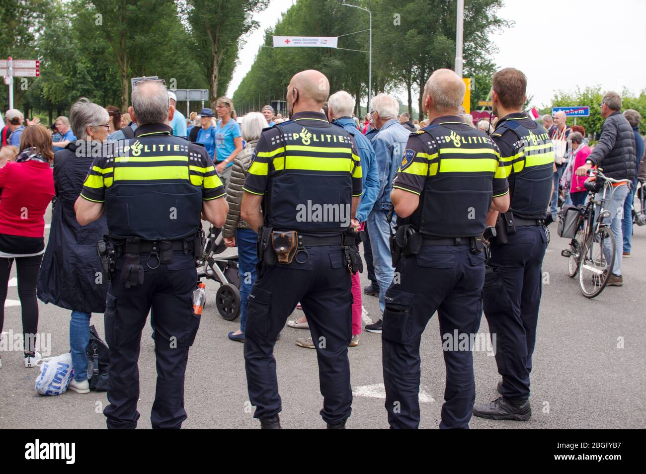 Arnhem, Netherlands - July 16,2019: Dutch police officers on the watch near Arnhem during International Four Days Marches Nijmegen Stock Photo