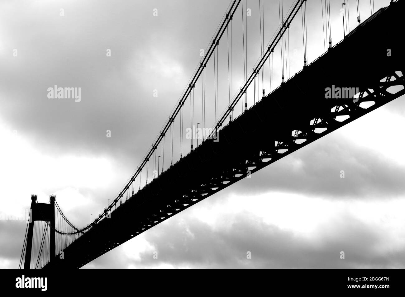 Large suspension bridge spanning a wide river Stock Photo - Alamy