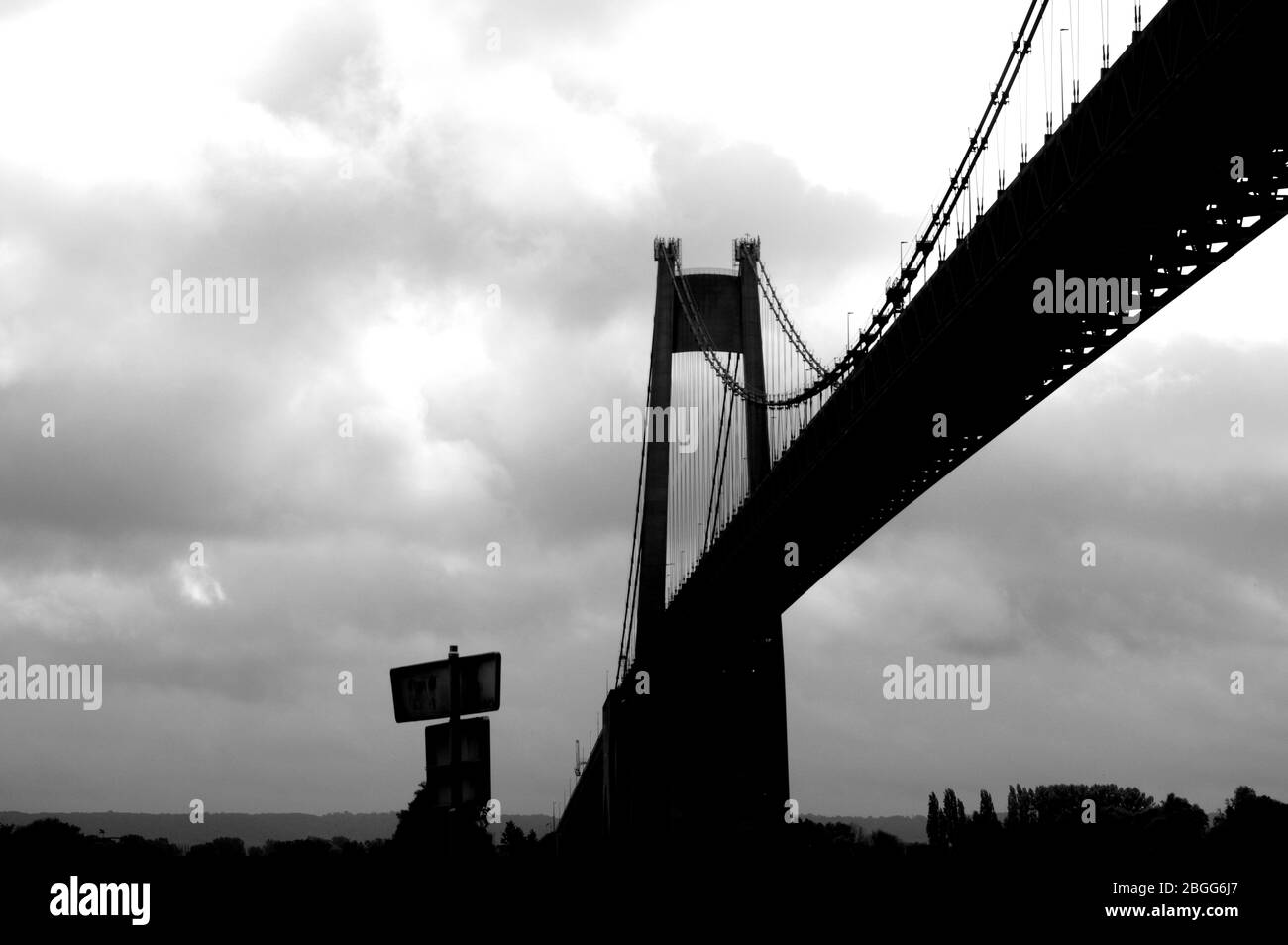Large suspension bridge spanning a wide river Stock Photo - Alamy