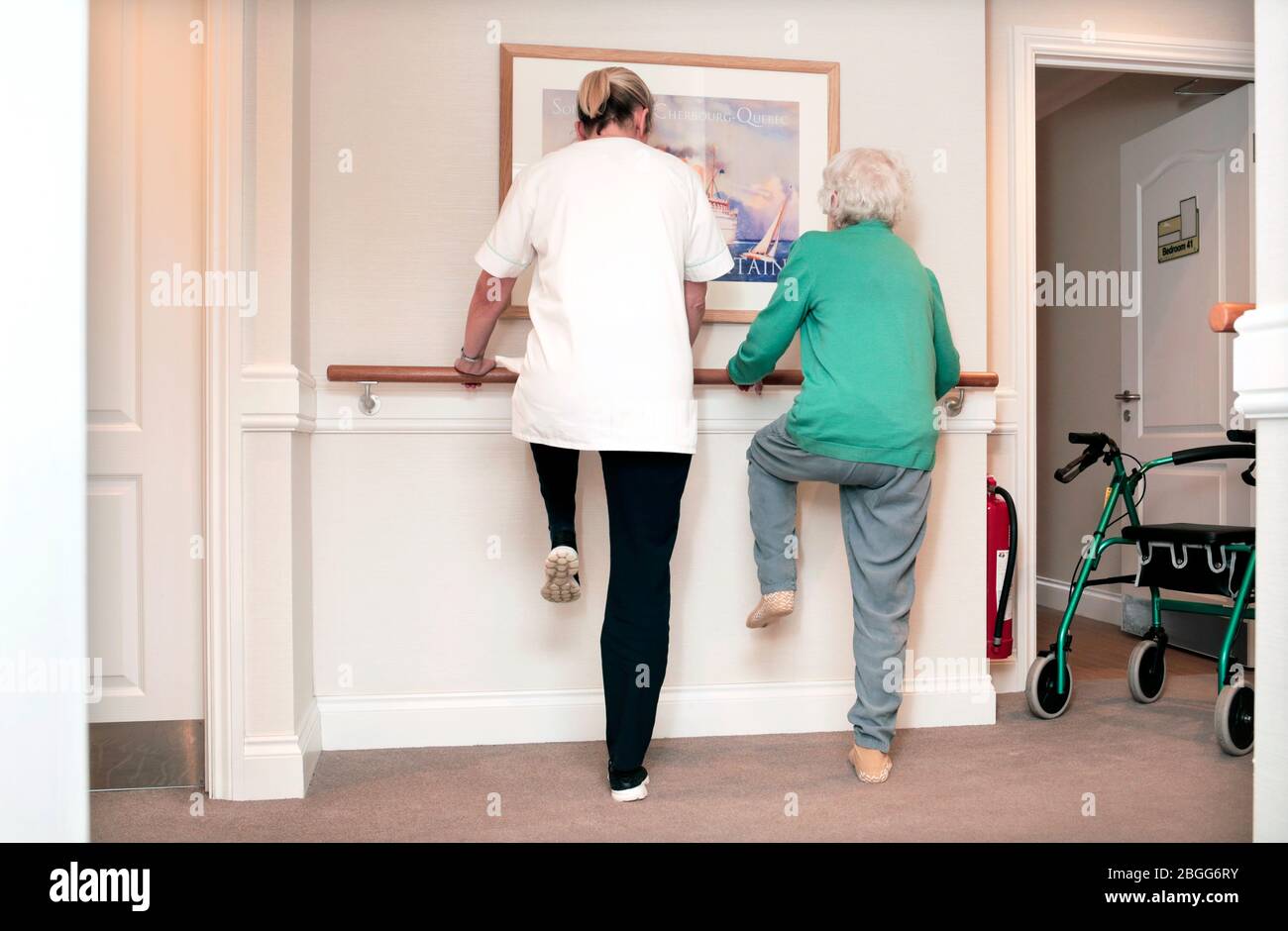 A member of satff exercises with a resident at a residential care home in Redcar, UK. 2/2/2018.  Photograph: Stuart Bolton. Stock Photo