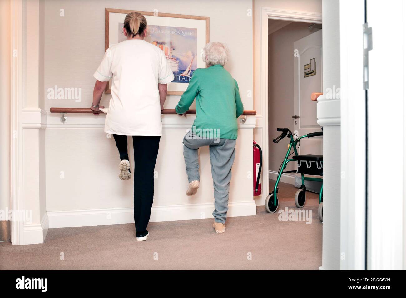 A member of satff exercises with a resident at a residential care home in Redcar, UK. 2/2/2018.  Photograph: Stuart Bolton. Stock Photo