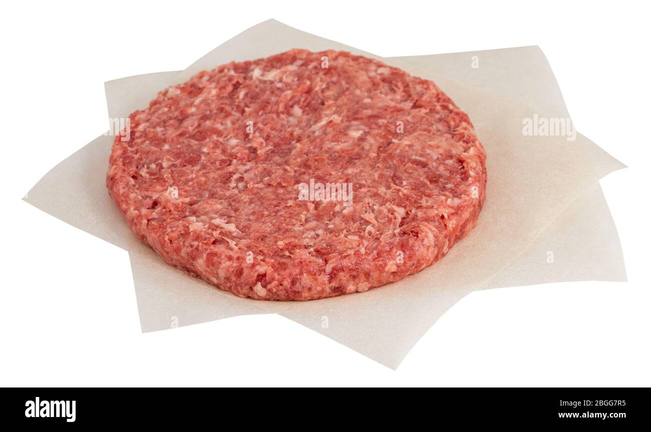 Raw fresh large beef burger isolated on white background. Stock Photo
