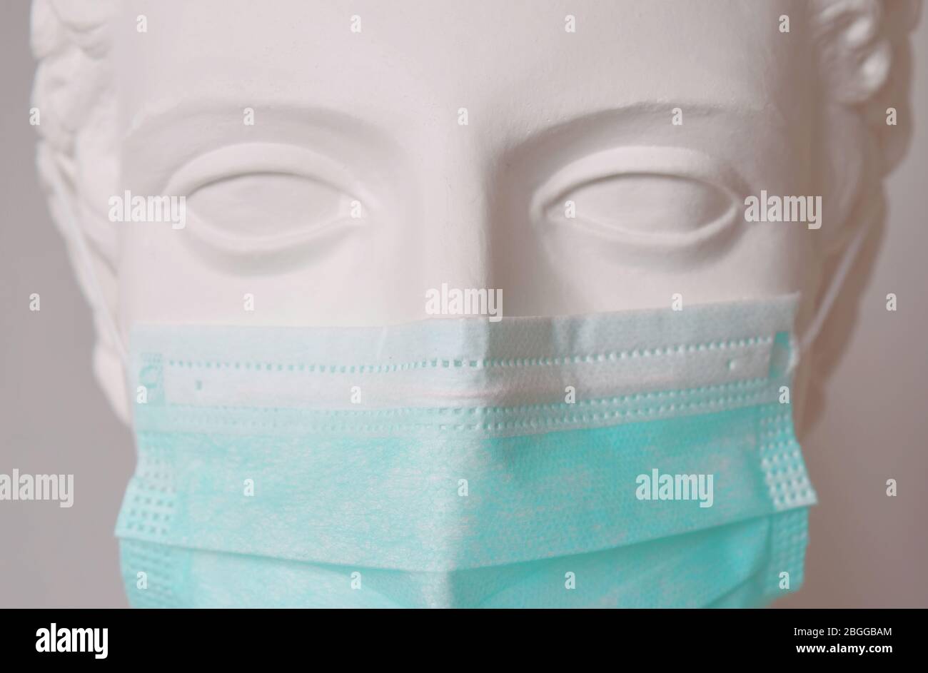 Face with mask. wearing protection face mask against viruses. Coronavirus pandemia protection. Close up view. Stock Photo