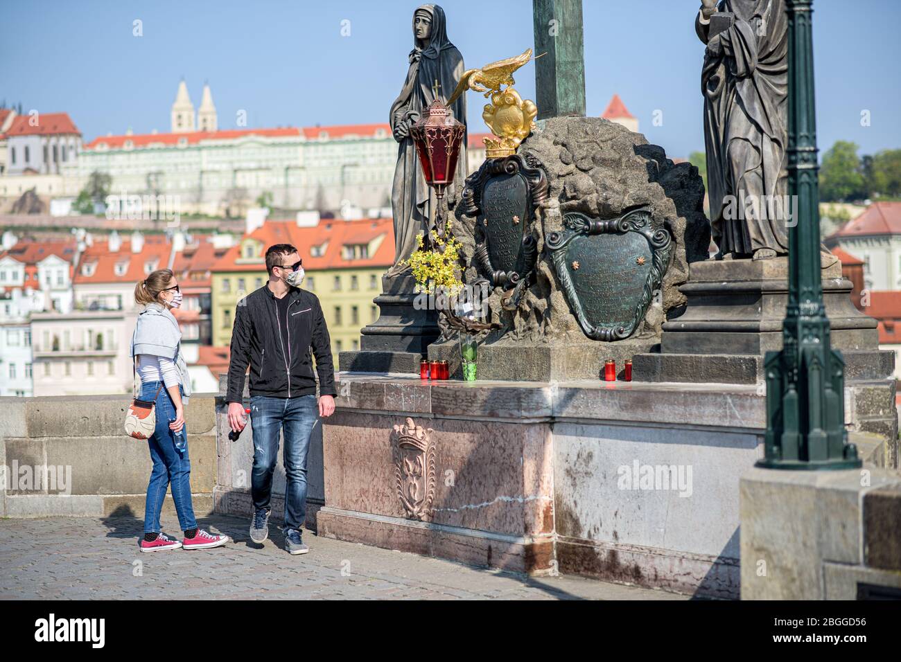 People on the Charles Bridge in Prague during quarantine Stock Photo