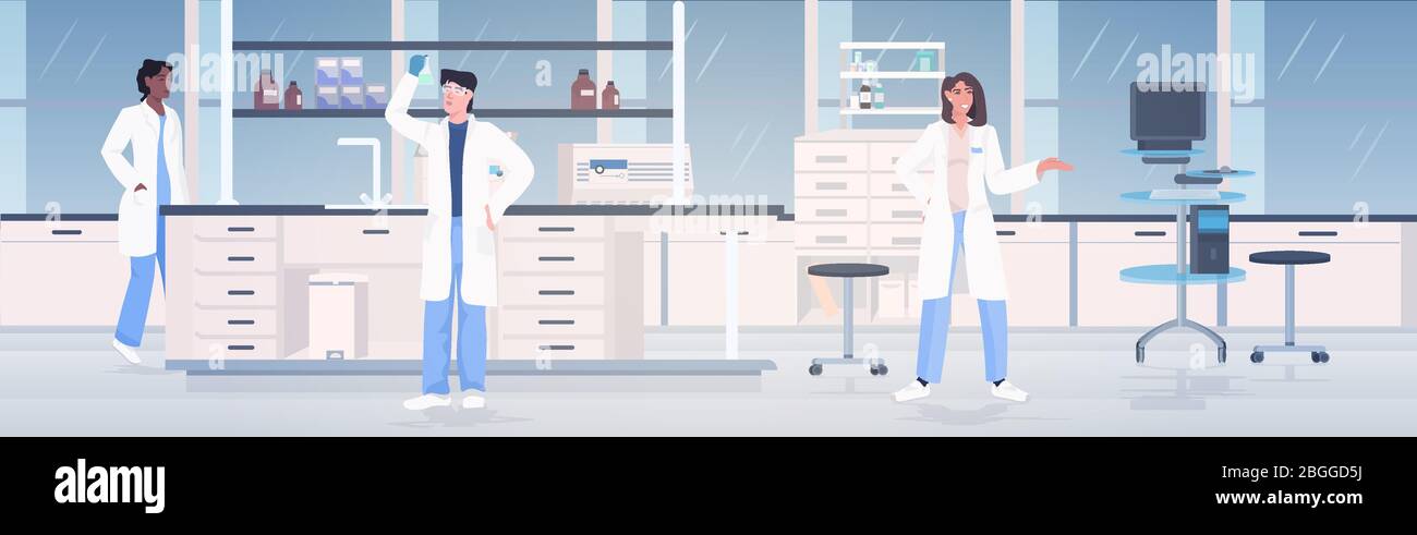 scientists team working in medical lab mix race researchers in white ...