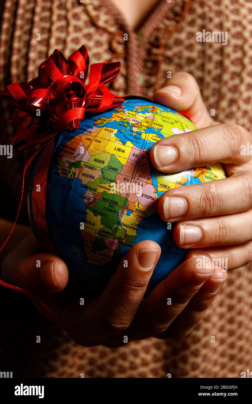 hands and world globe  © ABEL F. ROS/Alamy Stock Photo