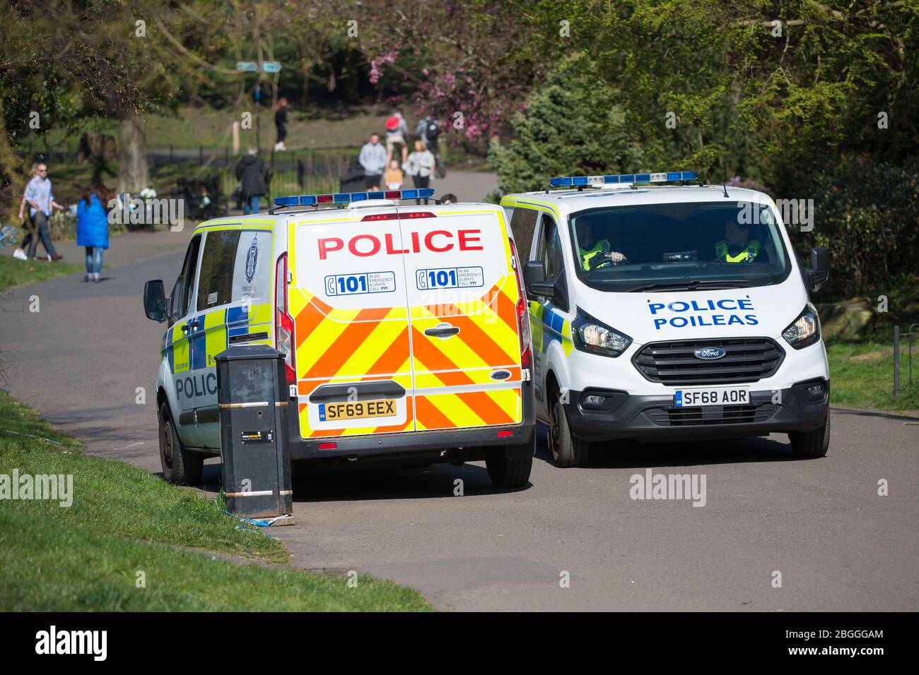 Glasgow, UK. 21st Apr, 2020. Pictured: A high police presence in the park to ensure that everyone is social distancing and taking not more than their allotted one hour of daily exercise. Scenes from Kelvingrove Park in Glasgow during the coronavirus (COVID-19) lockdown. Credit: Colin Fisher/Alamy Live News Stock Photo