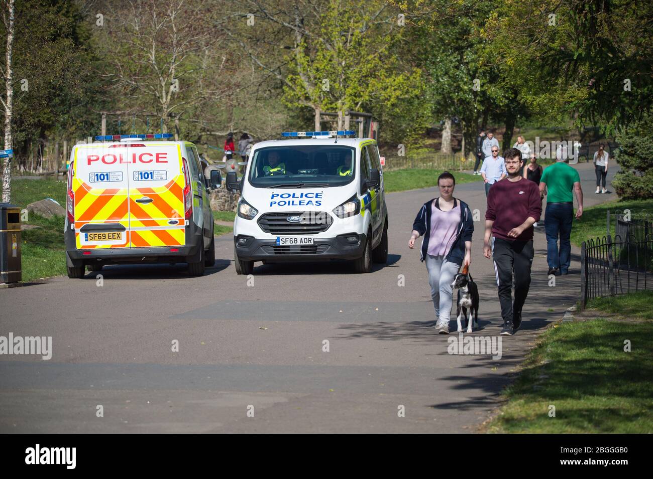 Glasgow, UK. 21st Apr, 2020. Pictured: A high police presence in the park to ensure that everyone is social distancing and taking not more than their allotted one hour of daily exercise. Scenes from Kelvingrove Park in Glasgow during the coronavirus (COVID-19) lockdown. Credit: Colin Fisher/Alamy Live News Stock Photo
