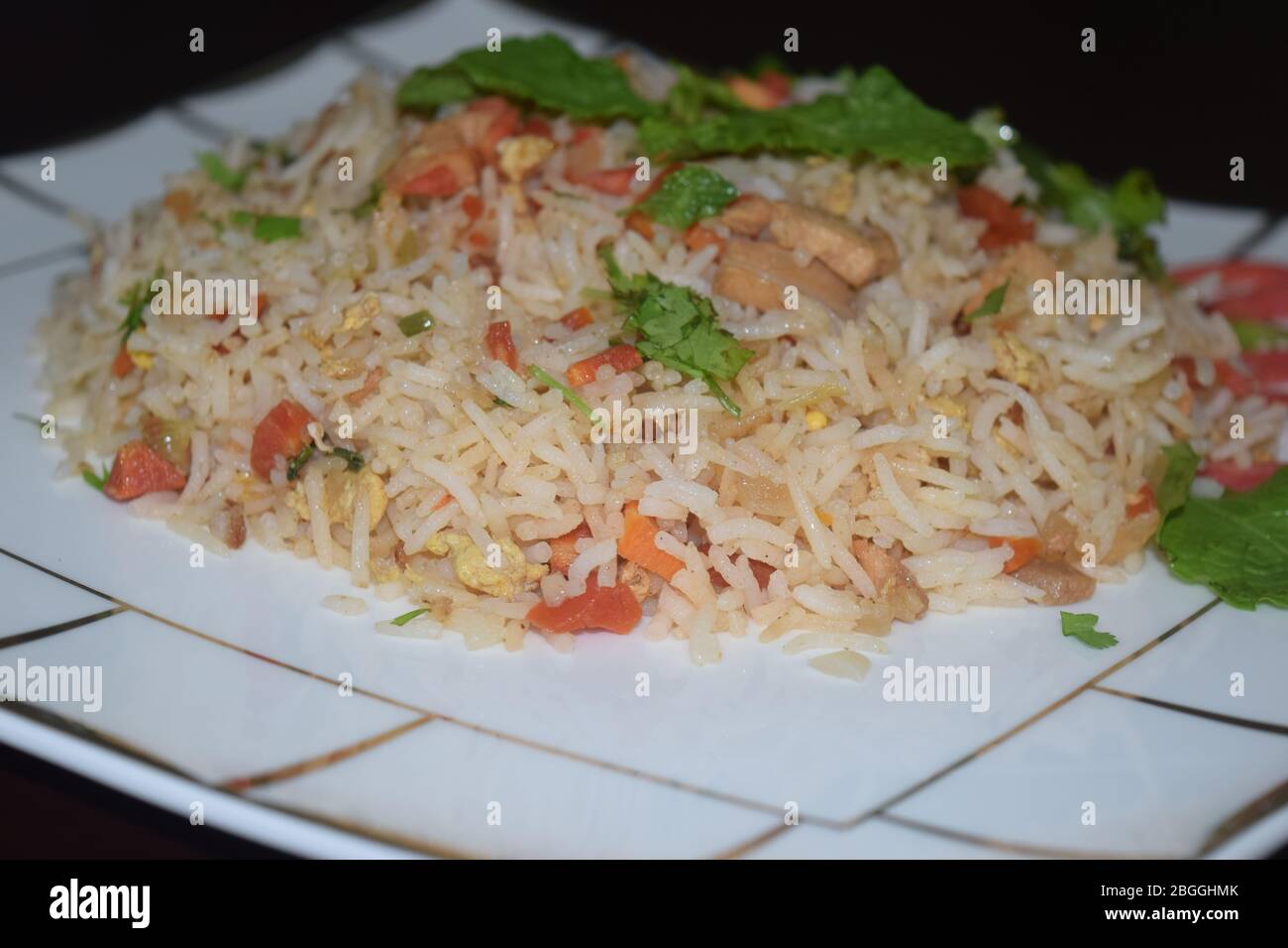 Egg fried rice with wooden background and space to add text Stock Photo