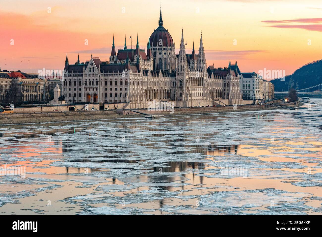 The Hungarian Parliament building with ice floes on the Danube in winter in Budapest, Hungary Stock Photo