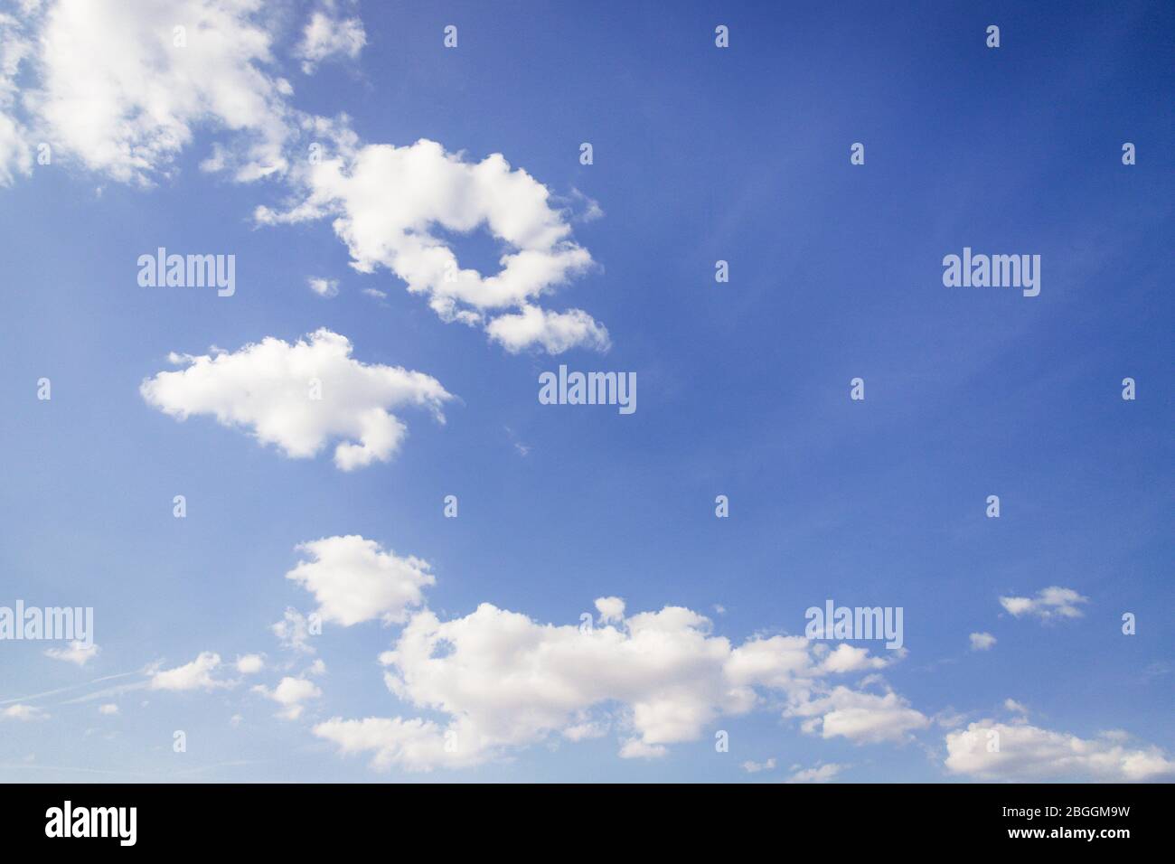 Blue sky background. Beautiful sky with puffy white clouds Stock Photo ...