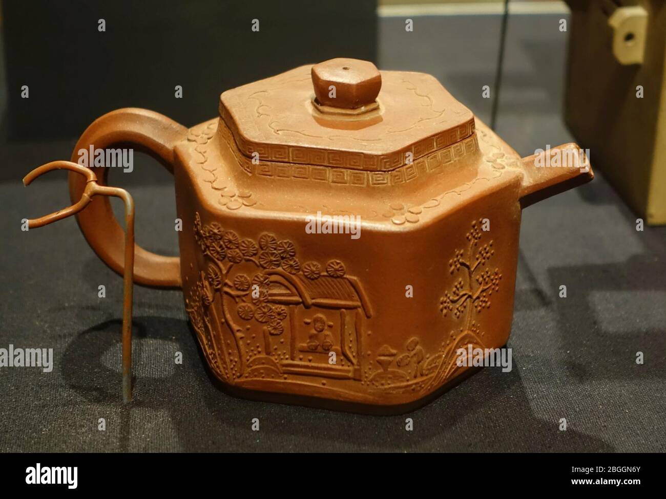 Hexagonal teapot with stamped inscription and landscape design, by Shao