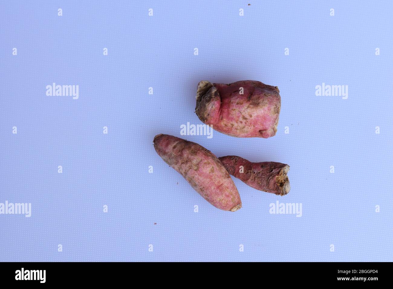 Fresh sweet potatoes isolated on white background Stock Photo