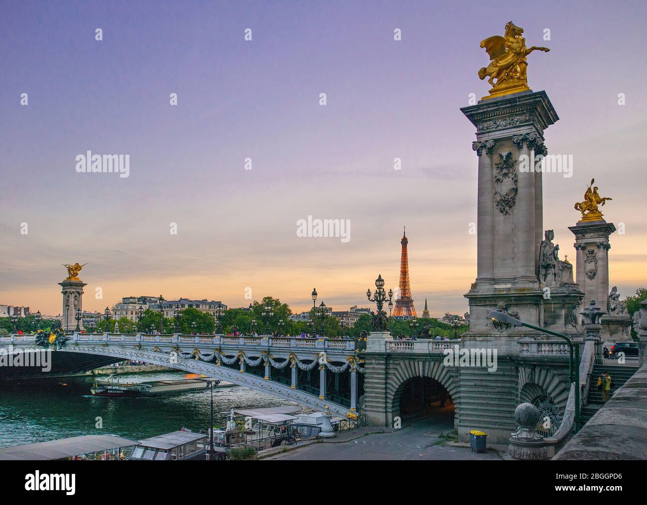 Pont Alexandre-III Bridge over River Seine at dusk with Eiffel Tower visible, Paris, France Stock Photo