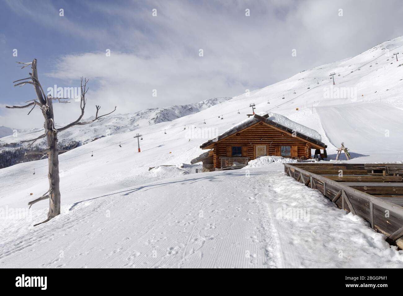 View from Bergrestaurant Schwemmalm also called Ausserschwemmalm to ski lift and slope Mountain Mutegg, Ultental, South Tyrol, Italy Stock Photo