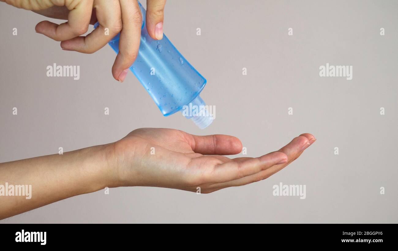 Women washing hands with alcohol gel or antibacterial soap sanitizer ...