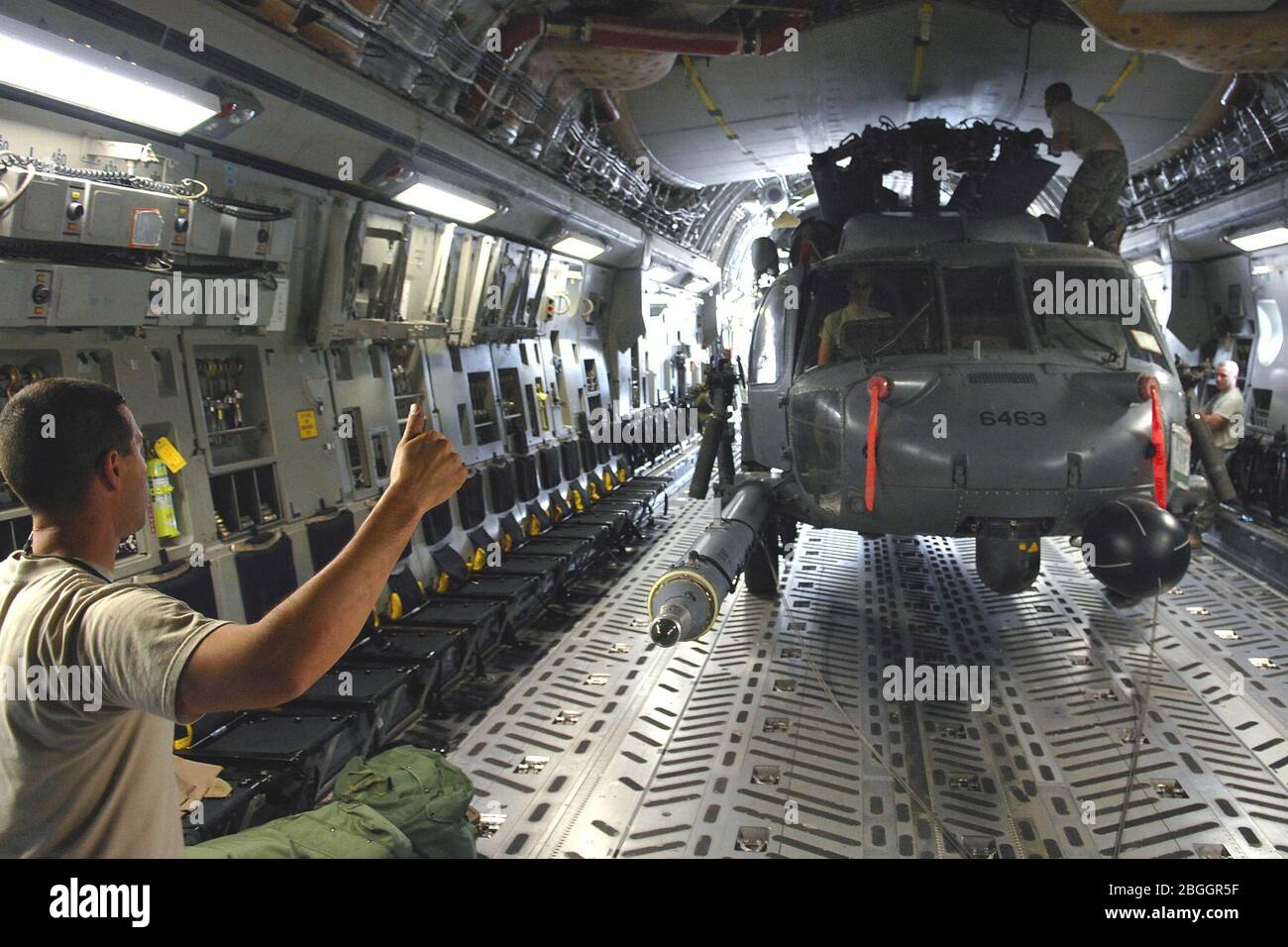 HH-60 Pave Hawk inside C-17. Stock Photo