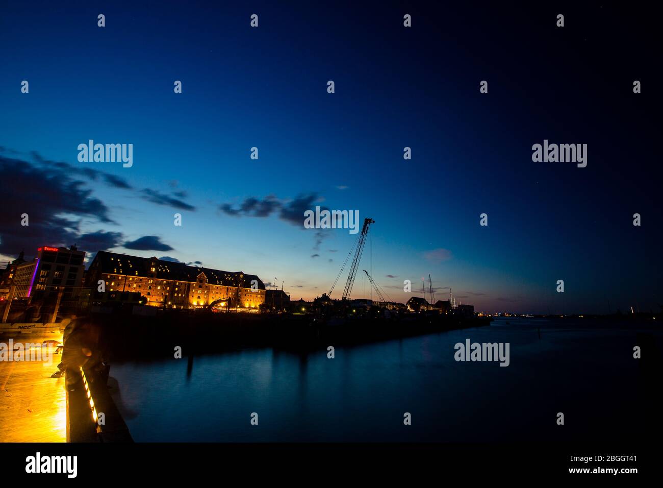 Evening view of old historical buildings in Copenhagen, Denmark, over the water. Shot at twilight (blue hour) Stock Photo
