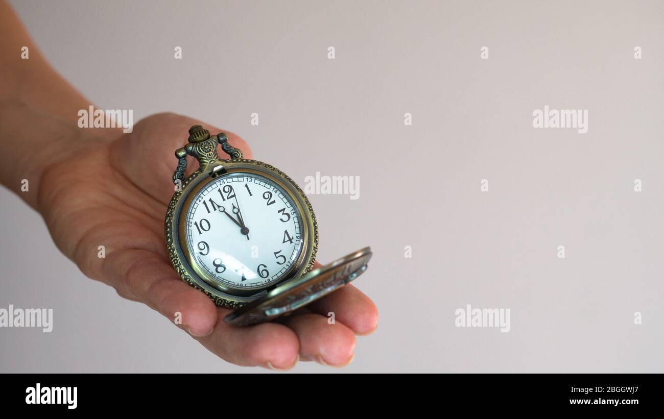 Old pocket watch in young woman's hand. Negative space Stock Photo - Alamy