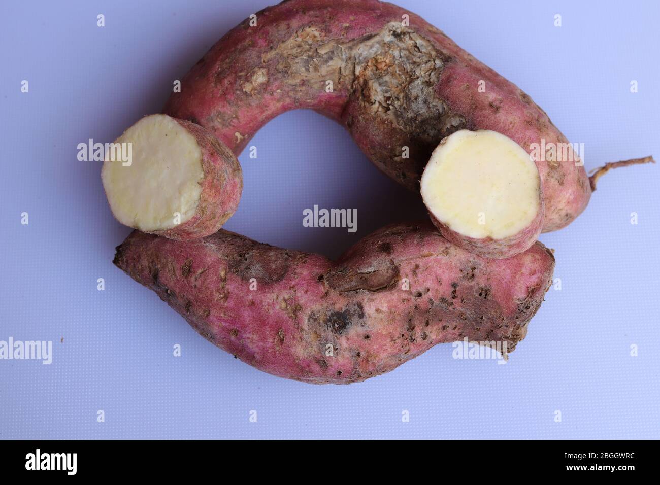 Fresh sweet potatoes isolated on white background Stock Photo