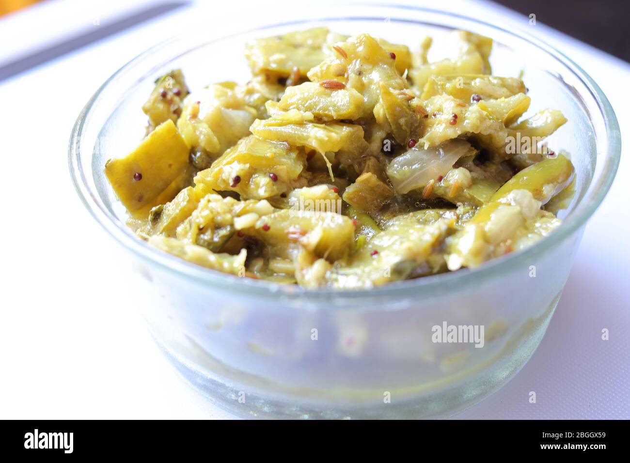 Fresh Ridge gourd curry isolated on white background Stock Photo