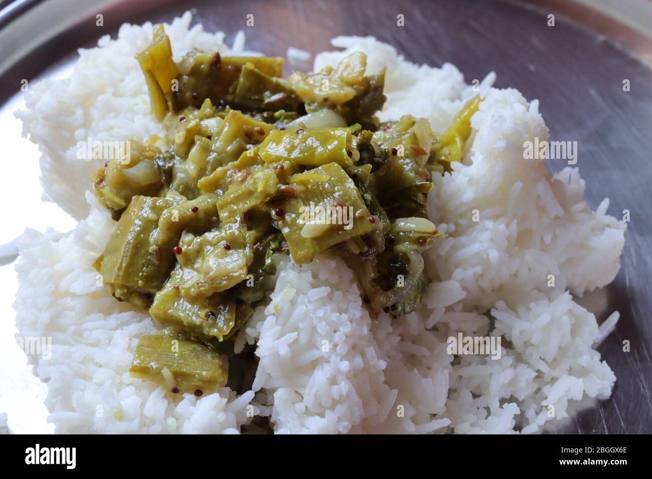 Fresh Ridge gourd curry with rice isolated on white background Stock Photo