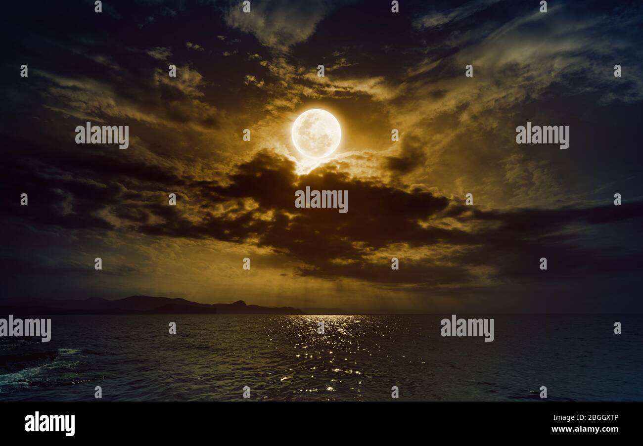 Dramatic Mystical Background Rising Yellow Full Moon In Dark Night Sky With Reflection In Water Elements Of This Image Furnished By Nasa Stock Photo Alamy