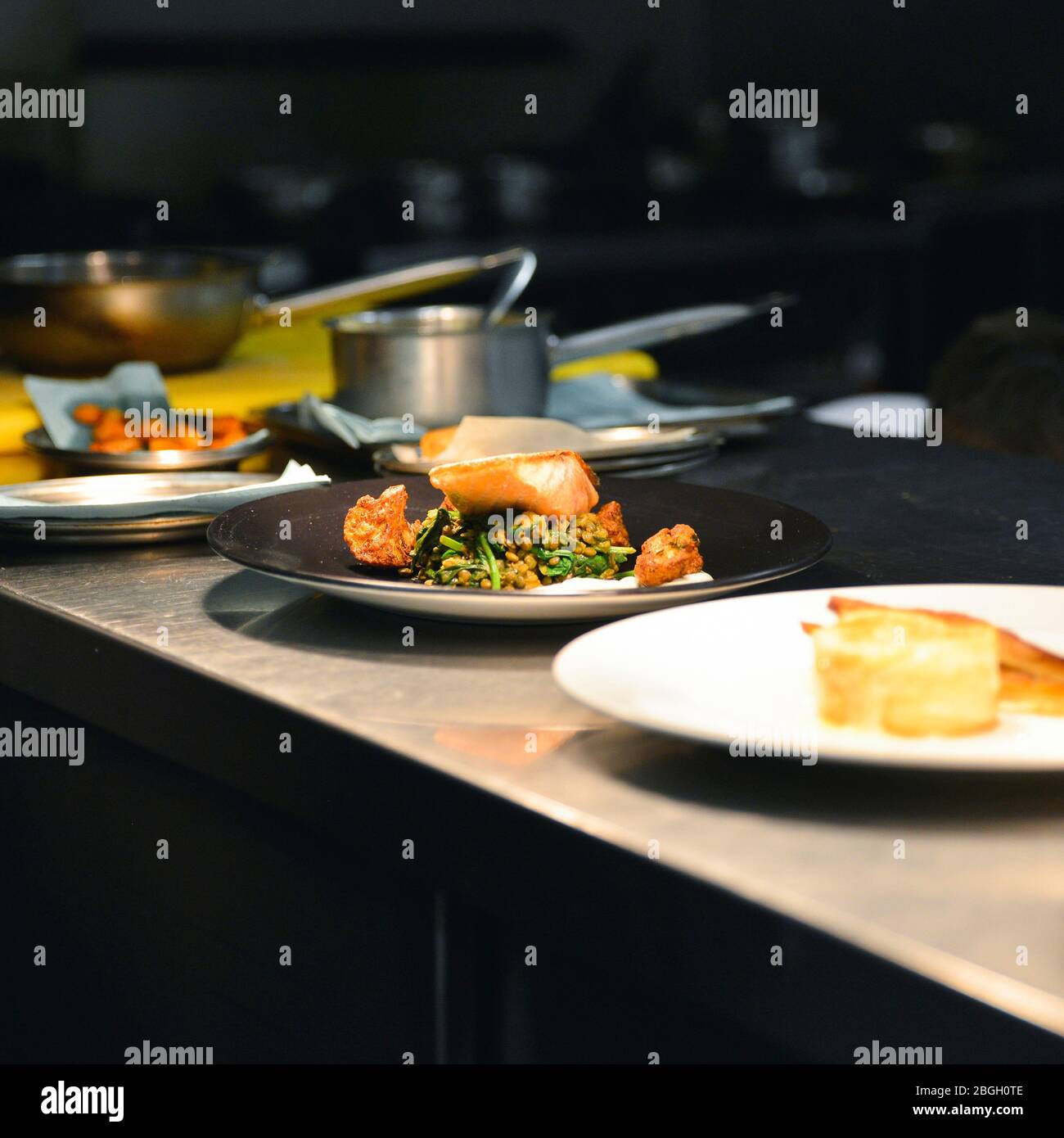 Plated Food waiting for Service in Restaurant Kitchen, Stock Photo