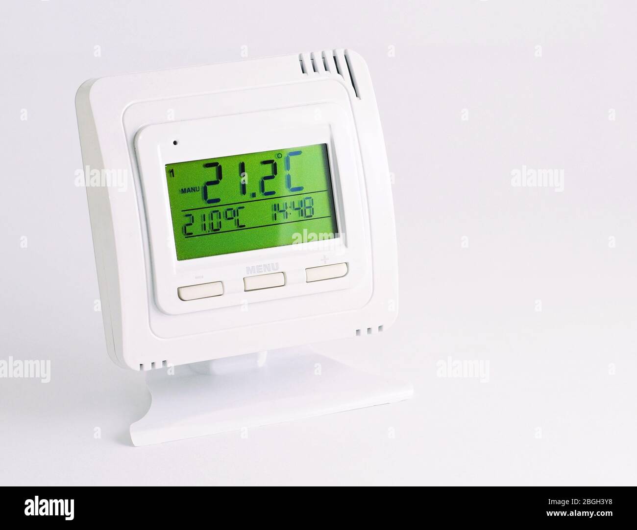 Remote home interior thermostat controller over white background. Stock Photo