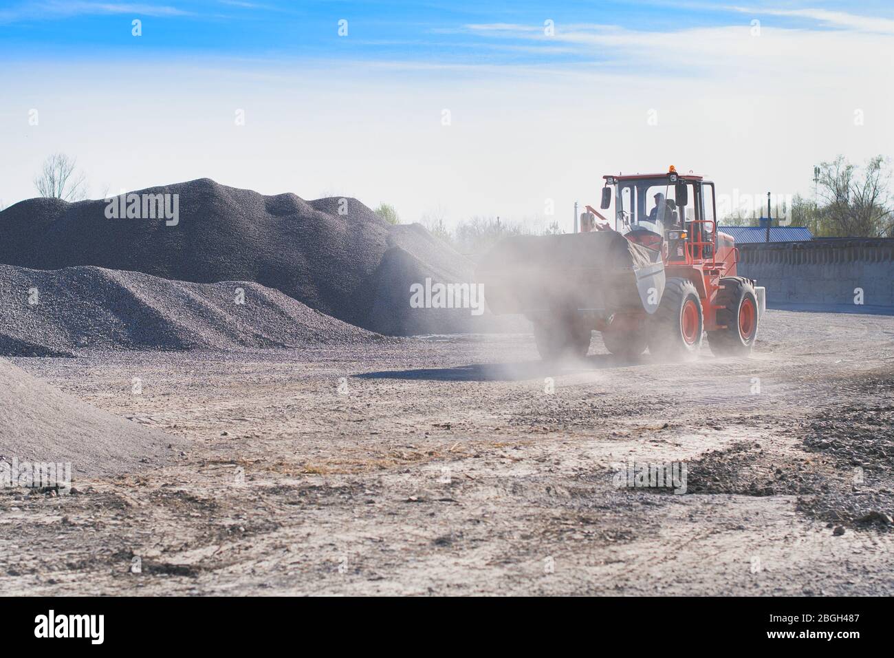 Mining industry. heavy wheel loader loading granite rock or ore at ...
