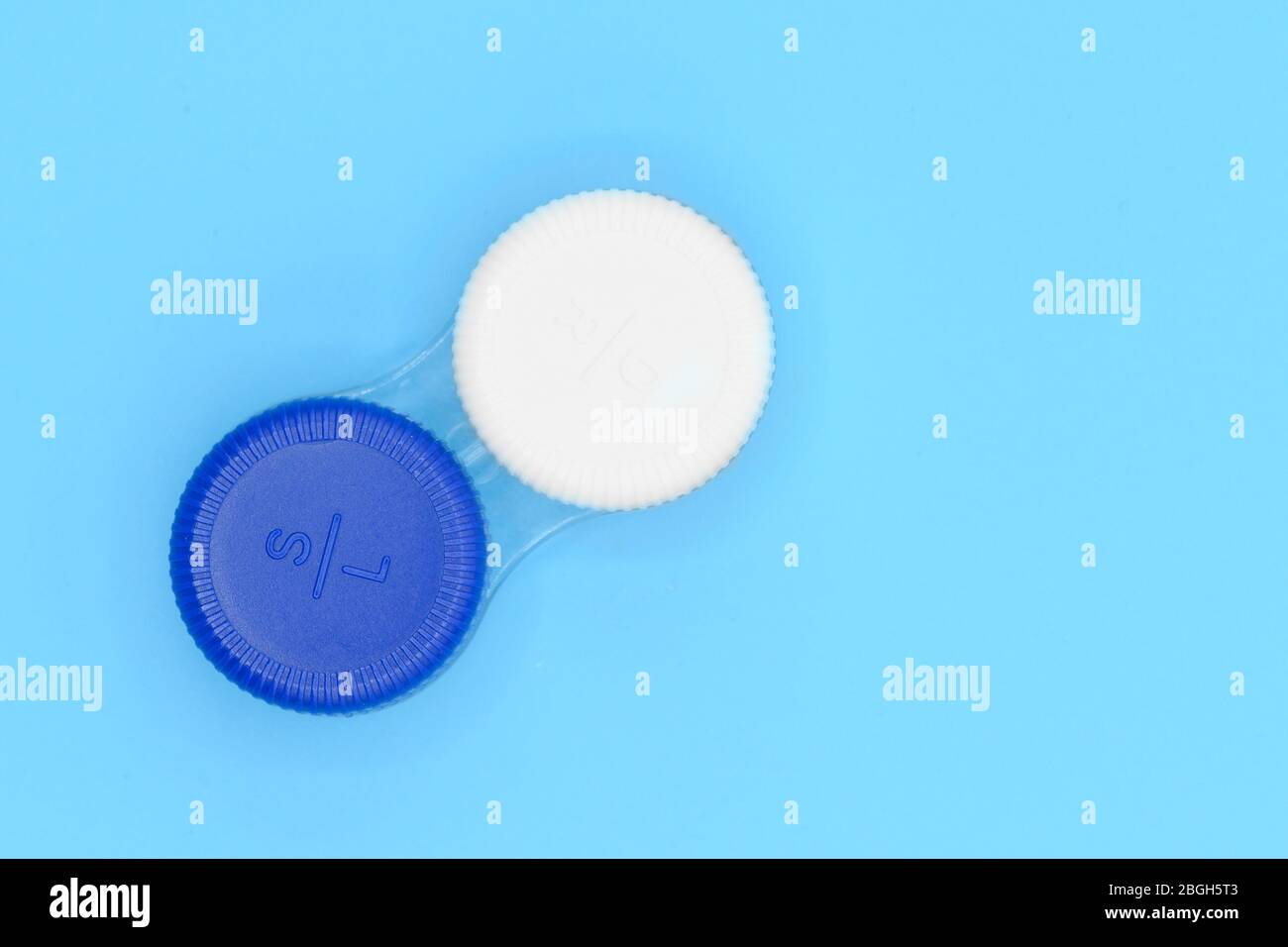 Contact lens case on blue pastel background . Stock Photo
