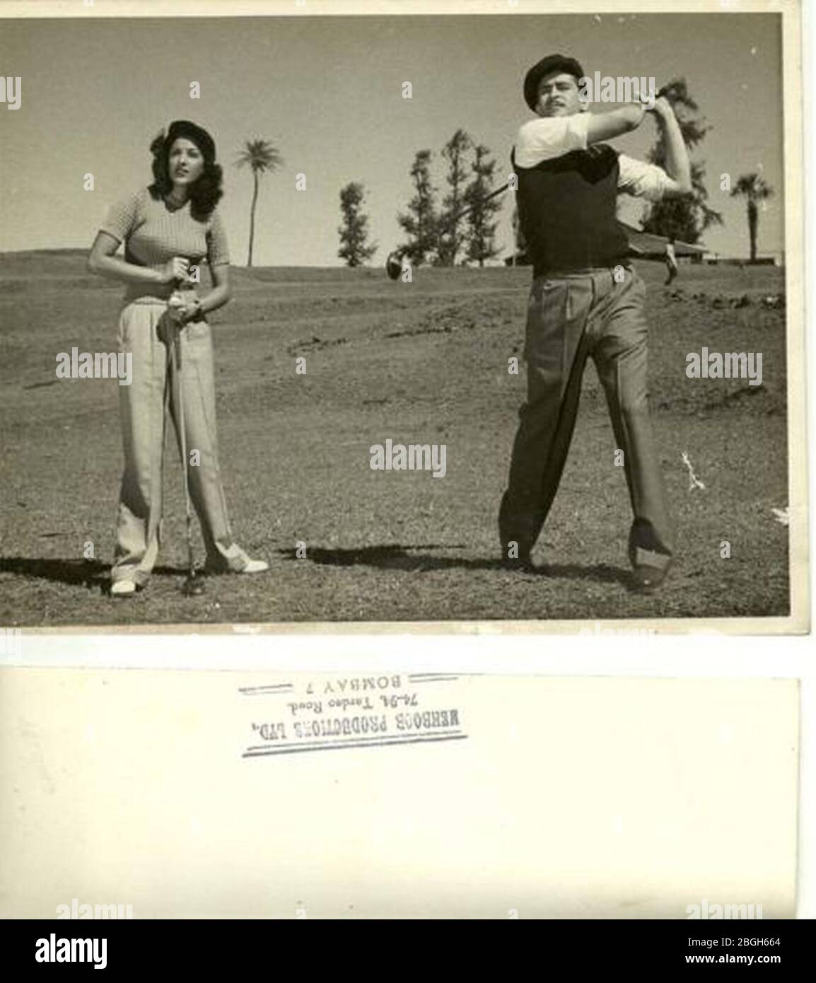 Hindi film stars Nargis and Raj Kapoor playing golf. Stock Photo