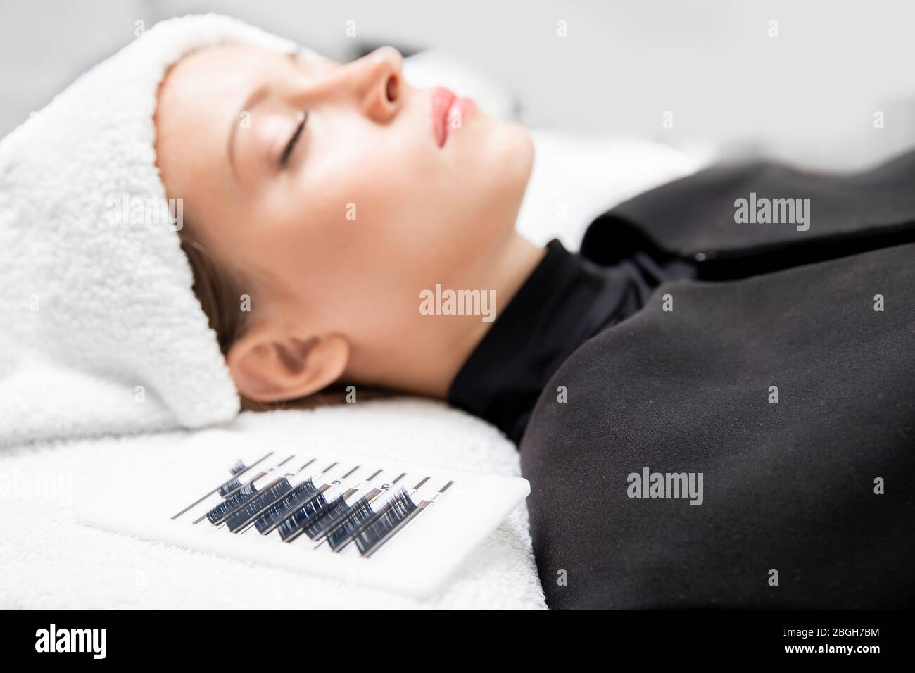 Eyelashes extensions. Lash extension procedure in spa beauty salon