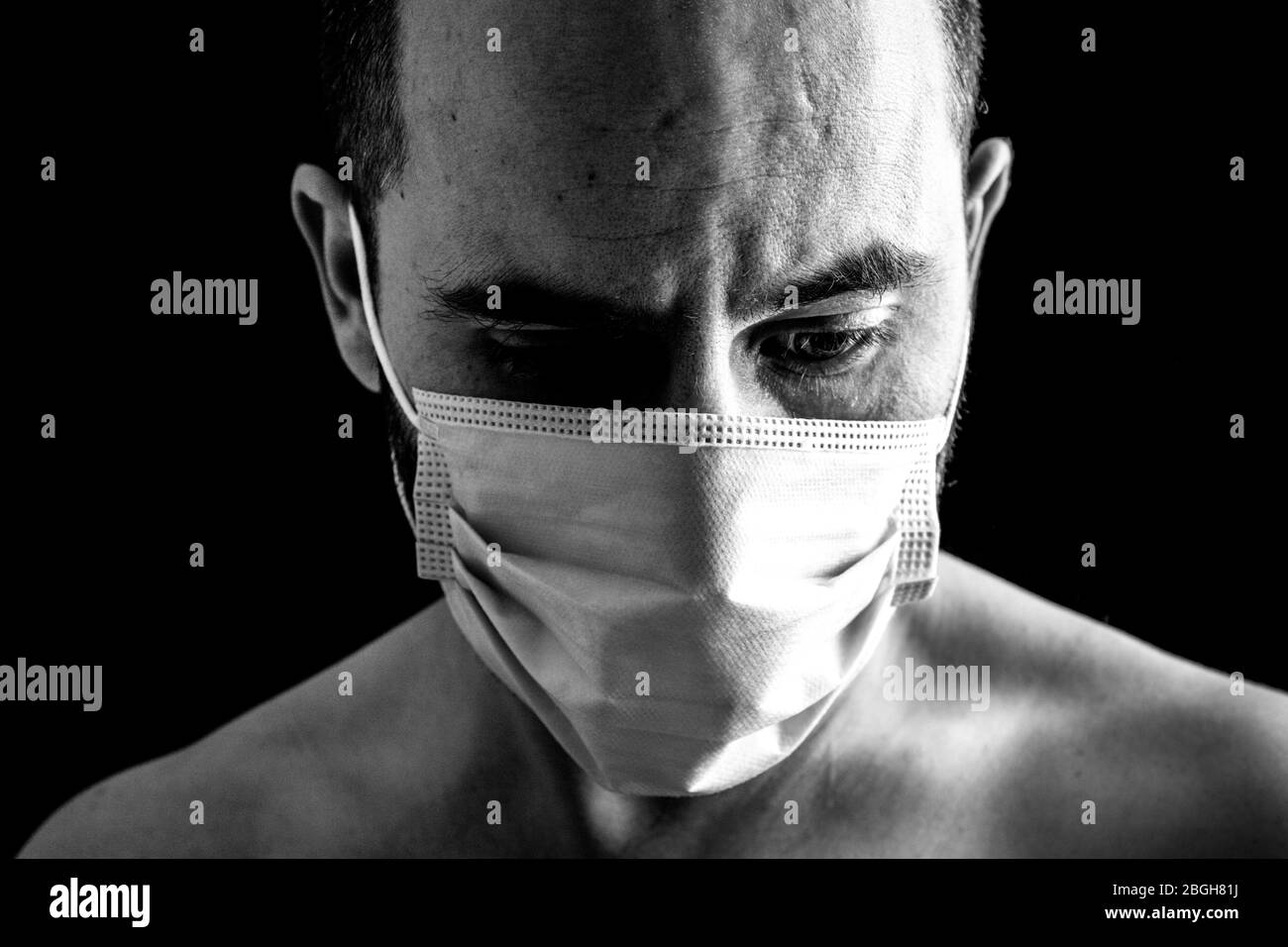 Close up wearing surgical mask Black and White Stock Photos & Images ...