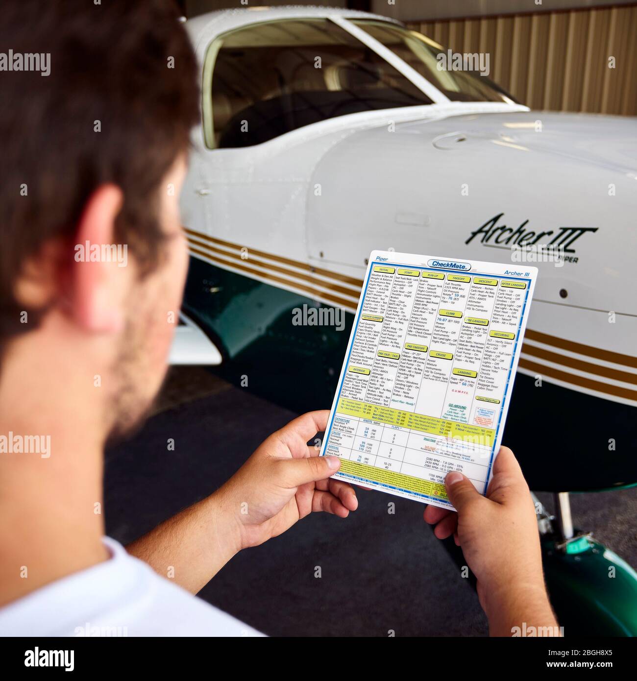A student pilot studies the preflight checklist Stock Photo Alamy