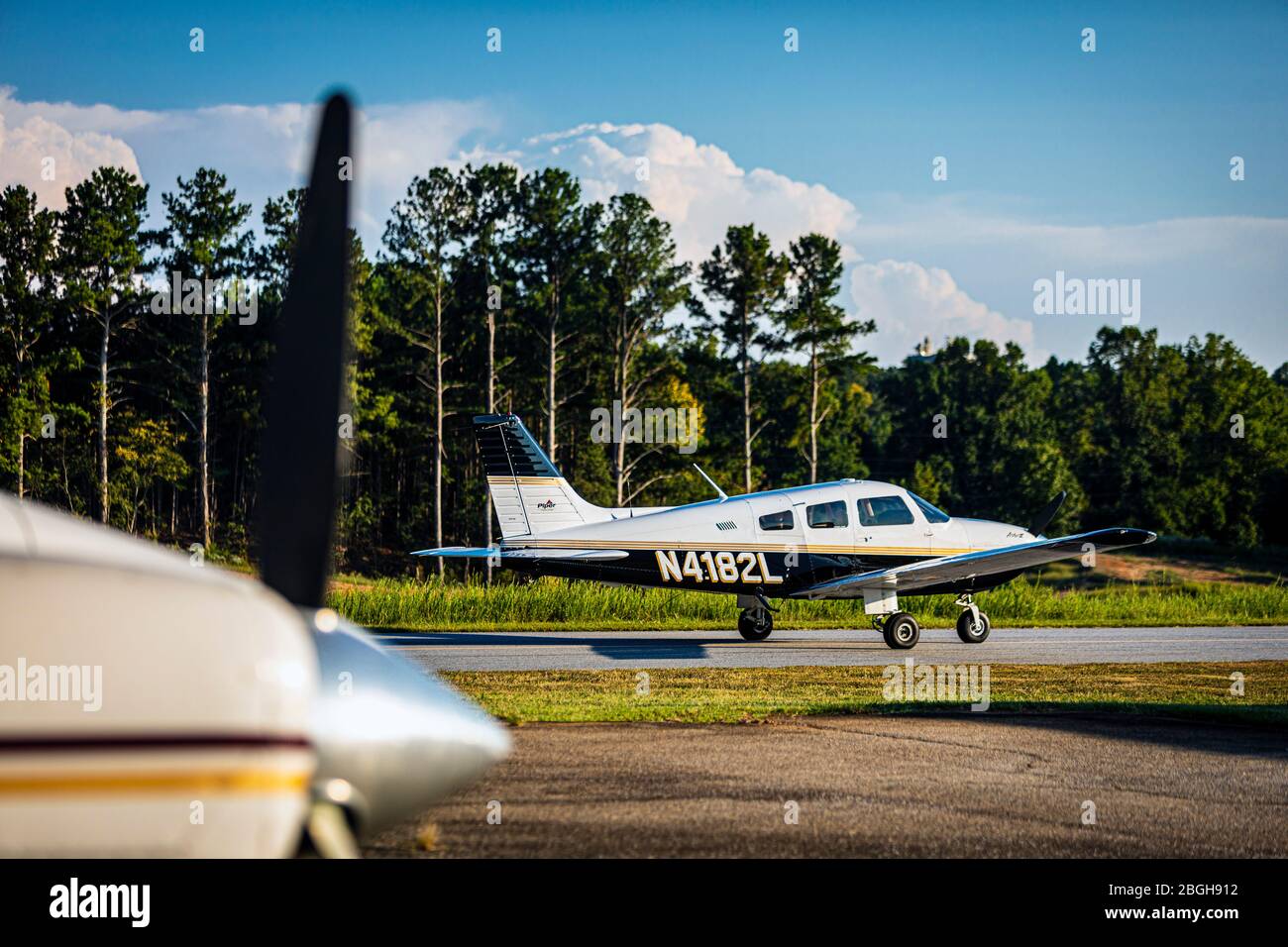 A Piper Archer general aviation aircraft on the taxiway at the