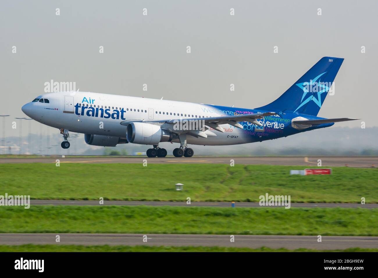 Paris / France - April 24, 2015: Air Transat Airbus A310 C-GFAT passenger plane departure and take off at Paris Charles de Gaulle Airport Stock Photo