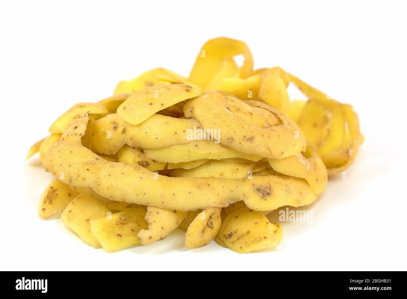 Potato peel against white background Stock Photo