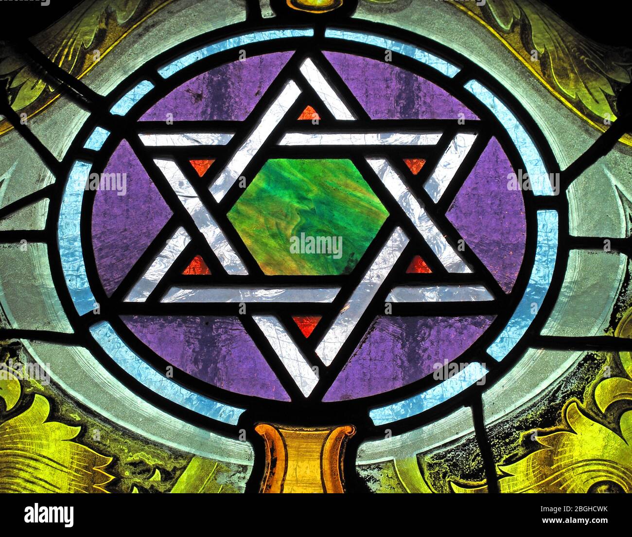 Jewish star of David, Shield of David, Magen David, in stained glass Stock Photo