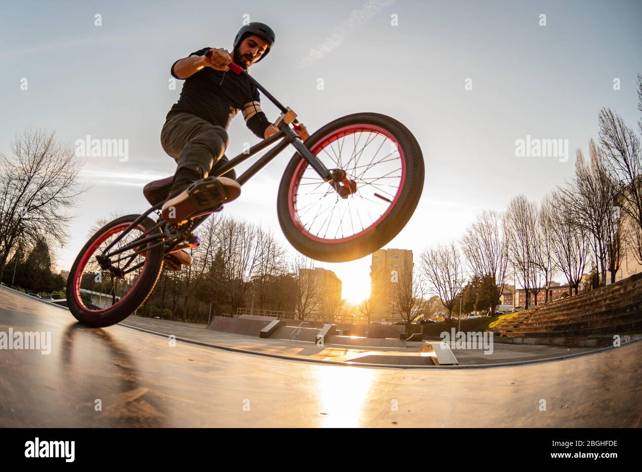 BMX trick in a wooden ramp at skate park Stock Photo - Alamy