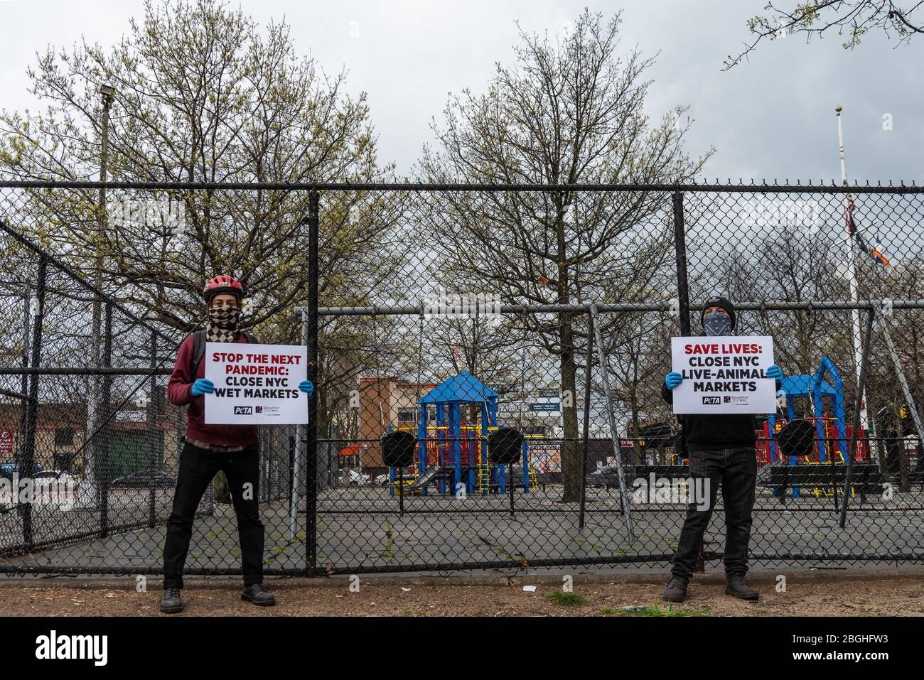 Brooklyn, United States Of America . 21st Apr, 2020. Urging the closure of live-animal markets to cut off the source of animal-borne diseases, animal rights advocated protest in front of a playground which is across from Aljazeera Live Poultry in Sunset Park, Brooklyn, on April 21, 2020. (Photo by Gabriele Holtermann-Gorden/Sipa USA)8 Credit: Sipa USA/Alamy Live News Stock Photo