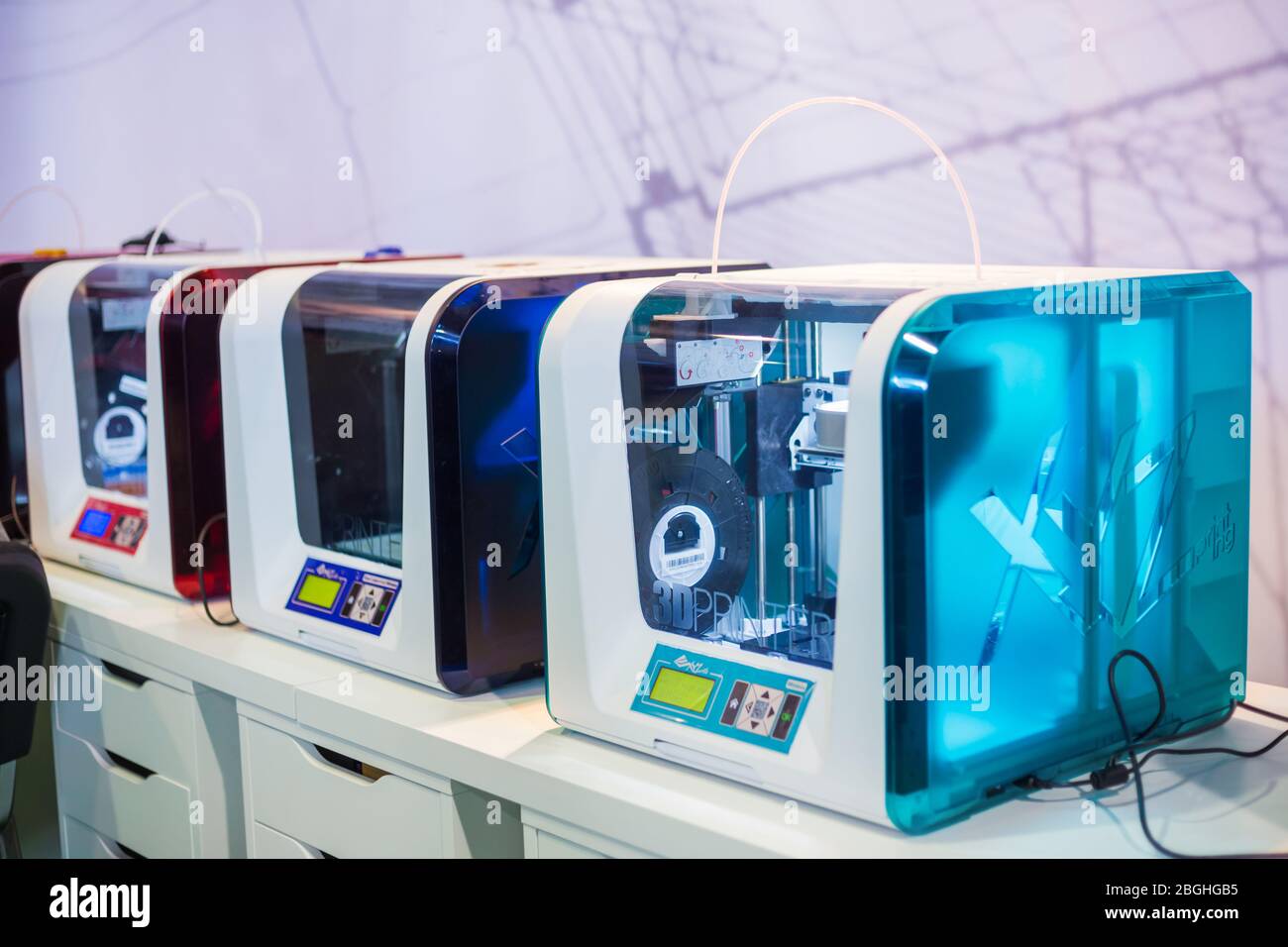 MOSCOW, RUSSIA - OCTOBER 12, 2018: 3D Print Expo - automatic 3D printers working at modern technology exhibition. 3D printing, additive technologies, Stock Photo
