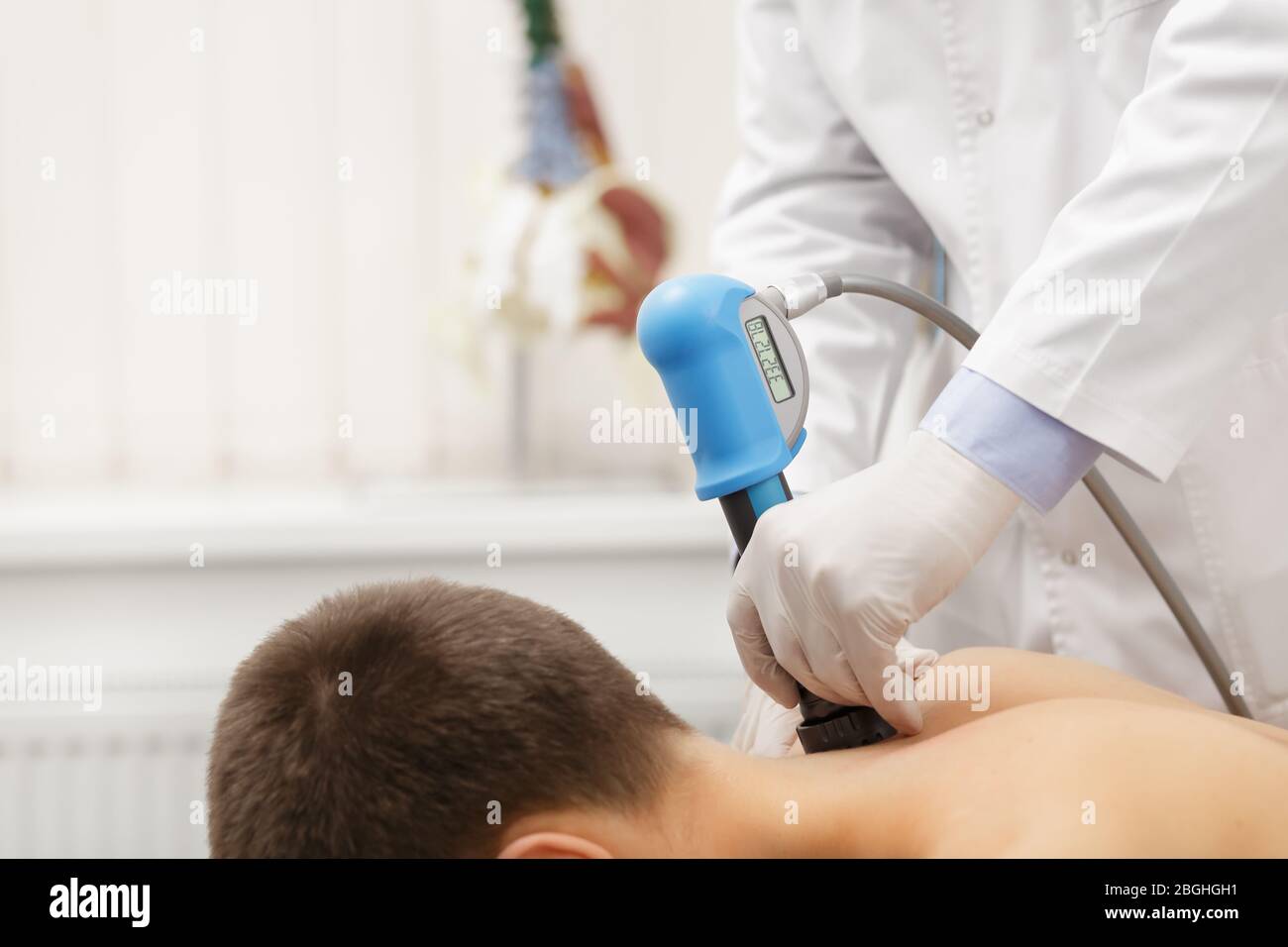 Extracorporeal Shockwave Therapy ESWT.Effective non-surgical  treatment.Physical therapy for lower back with shock waves.Pain relief,  normalization and Stock Photo - Alamy